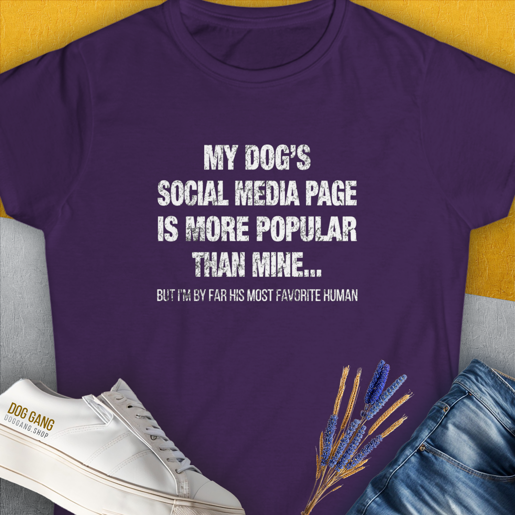 Purple womens t-shirt with the saying My Dogs Social Media Page Is More Popular Than Mine. Its a funny shirt for any dog lover. Designed by Dog Gang.