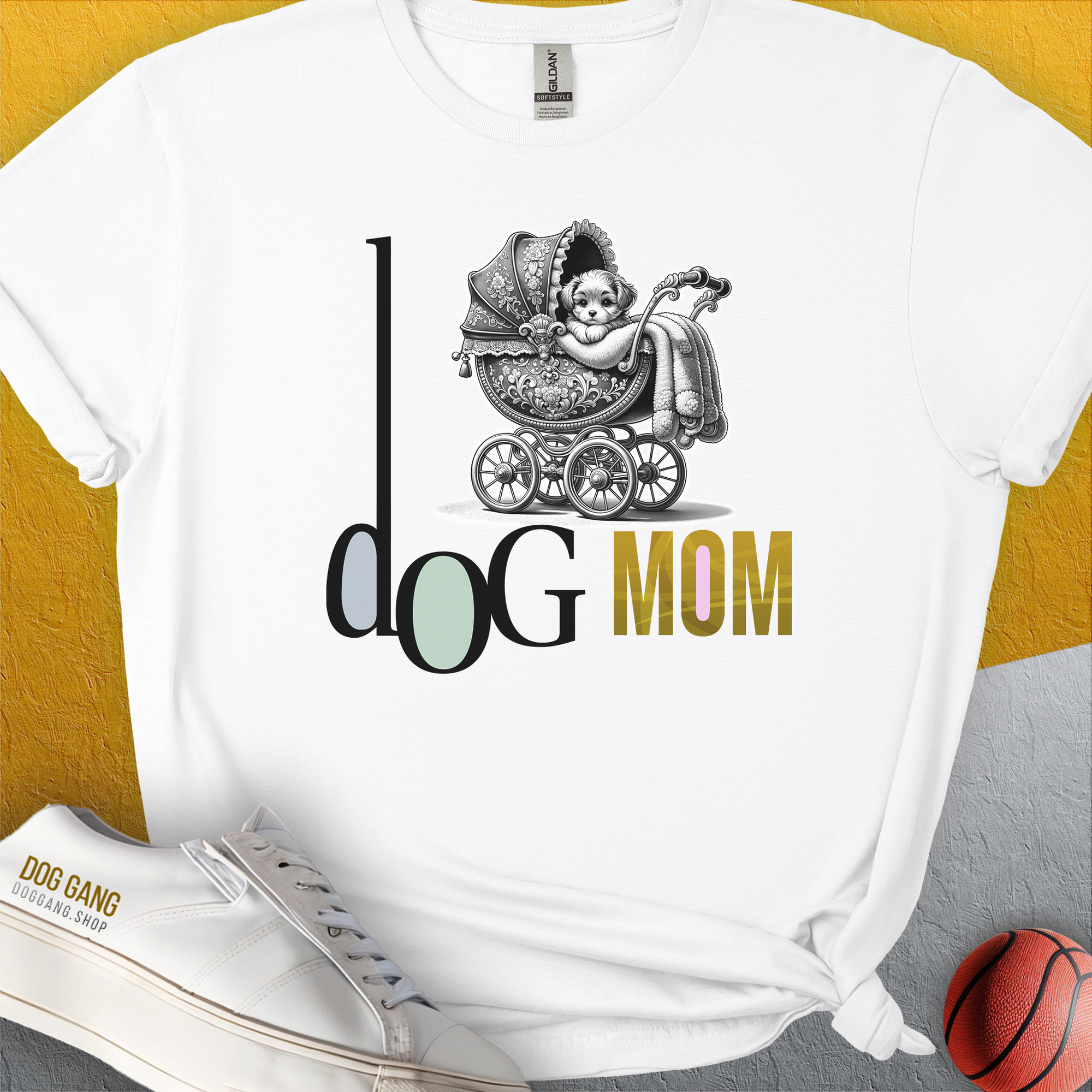The Dog Mom Series, Volume 5 Unisex T-Shirt features Dog Mom with a puppy in a vintage stroller design. Perfect for the stylish and cozy dog owner. Designed by Dog Gang.