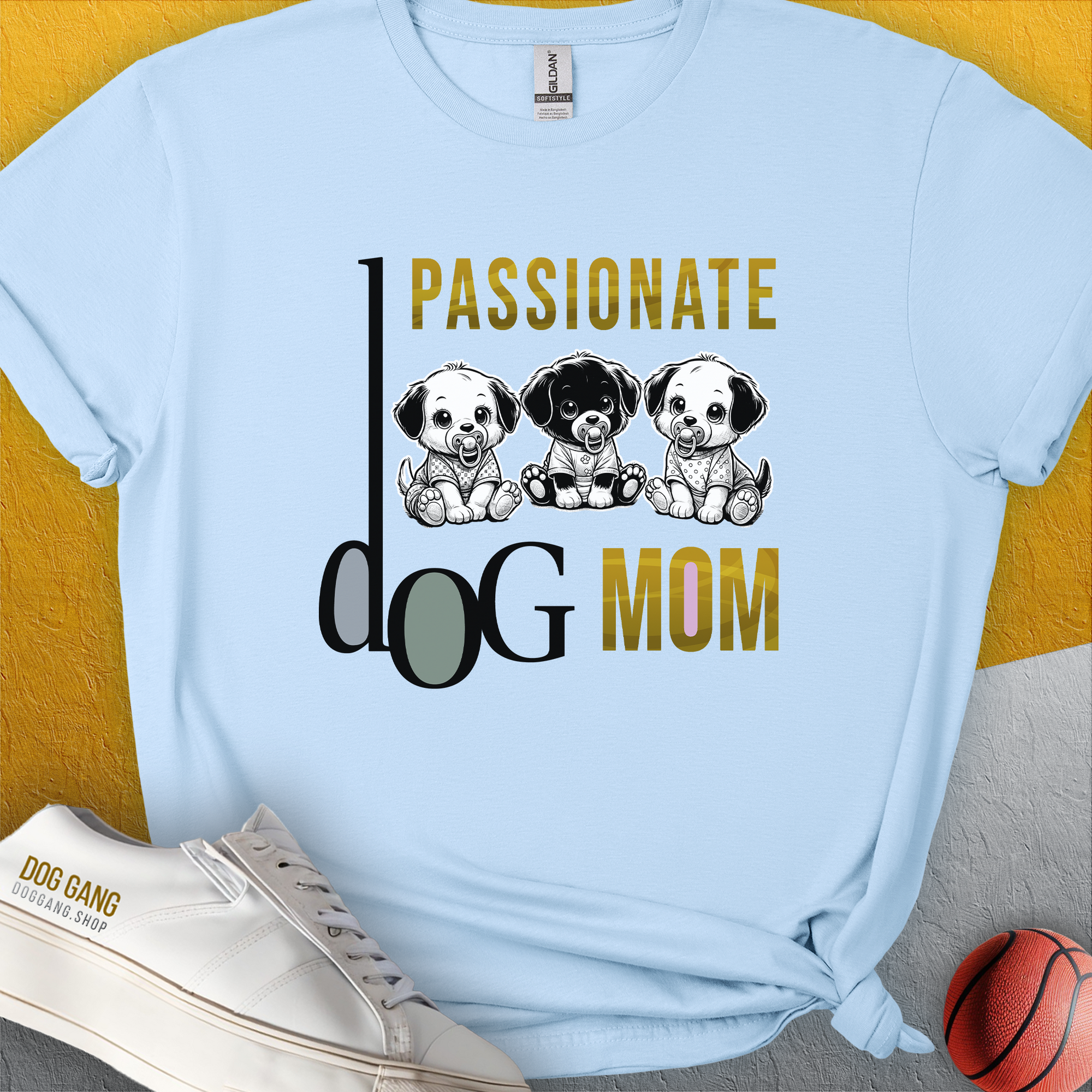 This Dog Mom Series, Volume 6, blue unisex T-shirt features the saying Passionate Dog Mom alongside three cute puppy illustrations. Designed by Dog Gang.