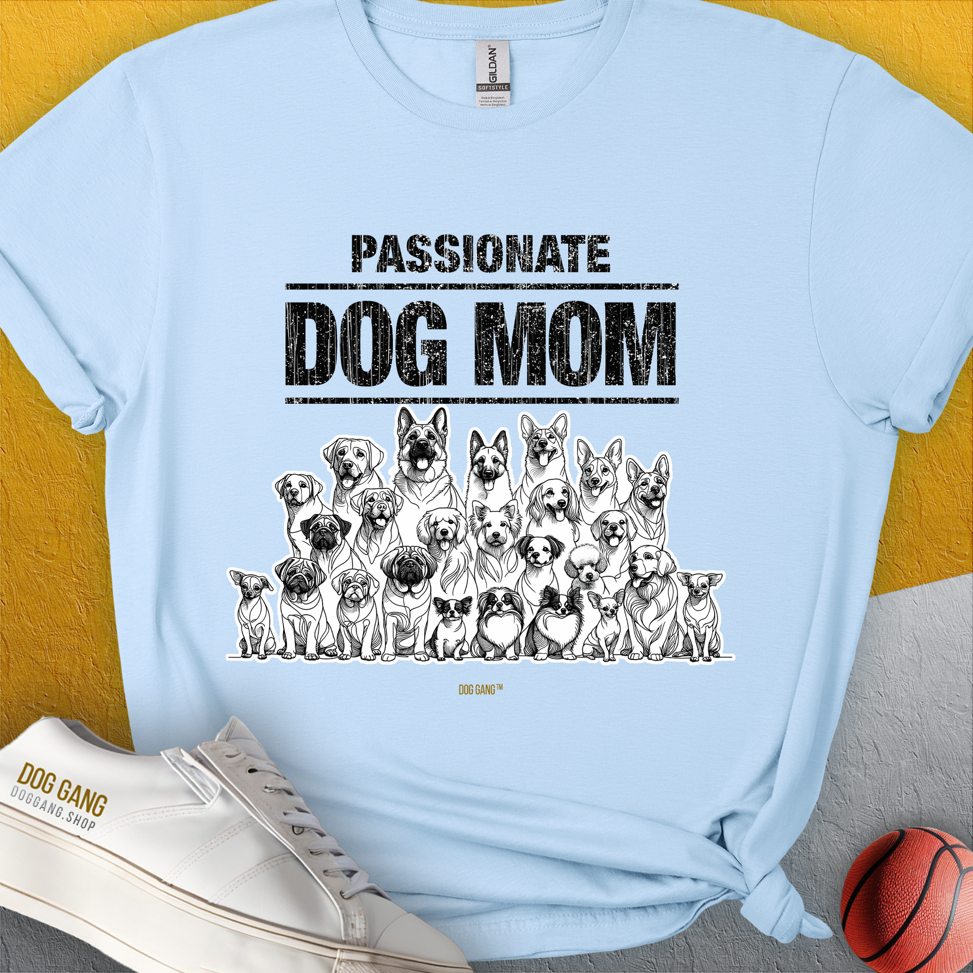 Dog-themed shirt in light blue features a Passionate Dog Mom quote with a dog graphic, perfect for dog lovers. Designed by Dog Gang.
