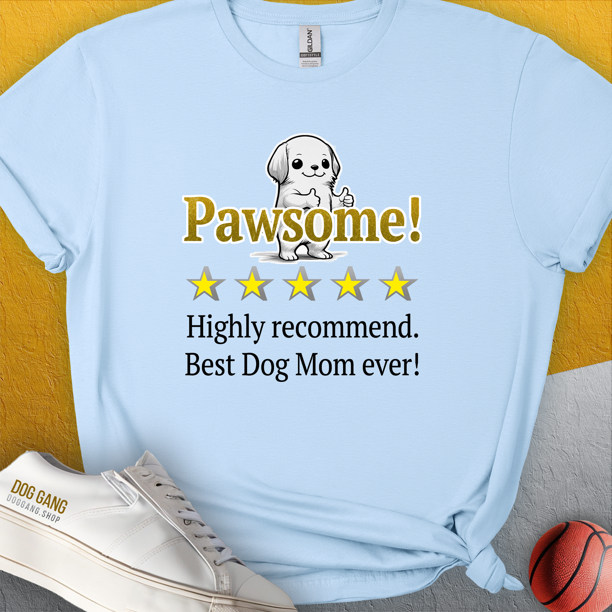 Light blue tee featuring an adorable dog graphic and cheerful text: Pawsome! Highly recommend. Best Dog Mom ever! Perfect for any dog lover. Designed by Dog Gang.