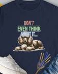 The navy Dont Even Think About It..., Volume 1 T-Shirt is a funny dog shirt featuring a poodle and ball illustration. Perfect for any dog lover. Designed by Dog Gang.