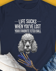 Womens navy shirt features a poodle illustration with the text Life Sucks When Youve Lost Your Favorite Fetch Ball, Volume 7. Its a funny dog-themed design for every dog lover. Designed by Dog Gang.