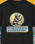 A funny dog shirt in black features a cartoon dog with a pocket watch and the playful quote: Every Hour You Spend With Me Is 10 Hours In My World. Designed by Dog Gang.