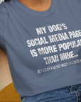 My Dogs Social Media Page Is More Popular Than Mine, Unisex T-Shirt- funny dog-themed Shirt. Design by Dog Gang