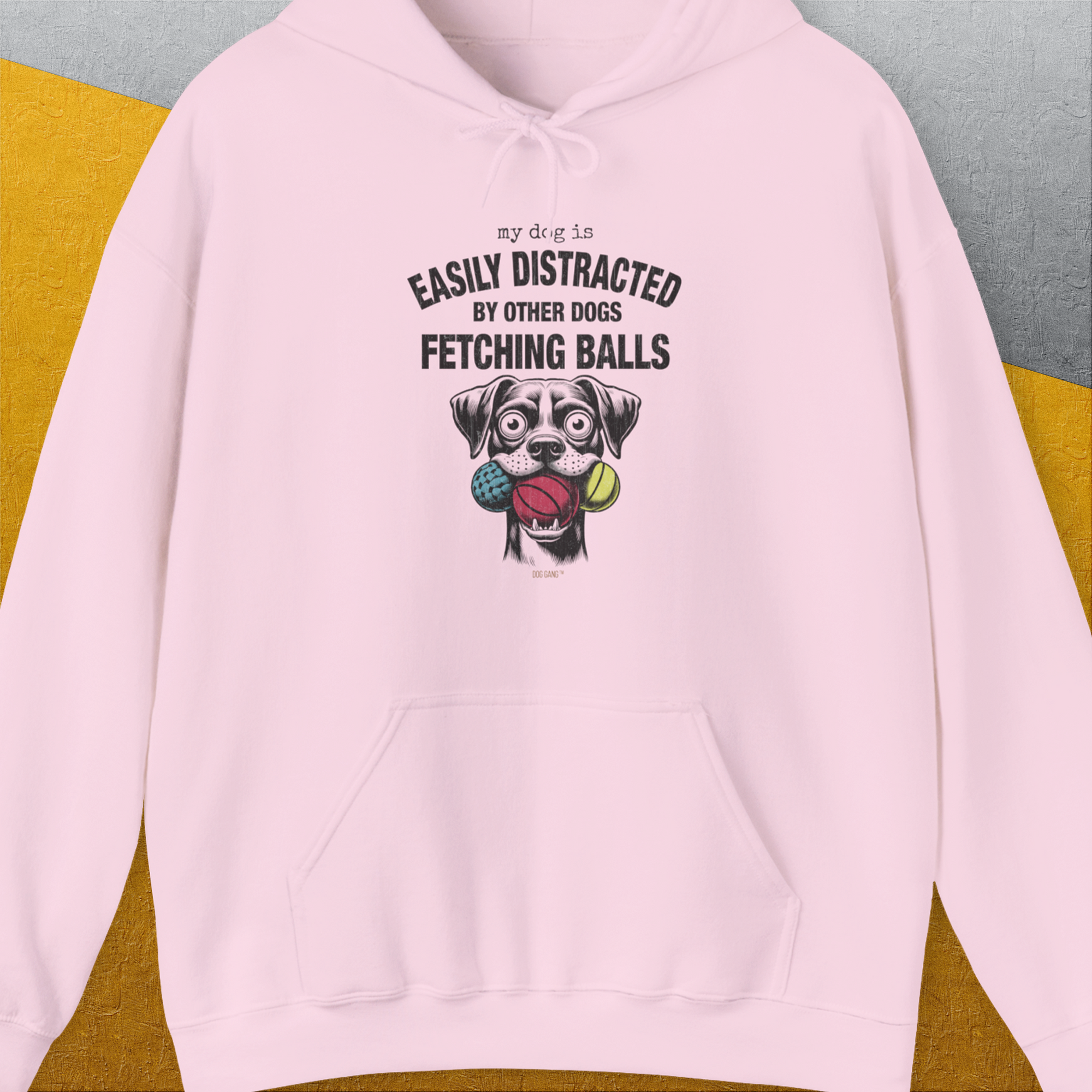 The My Dog Is Easily Distracted By - Volume 4: Other Dogs Fetching Balls hoodie showcases a funny dog illustration with the saying. Designed by Dog Gang.