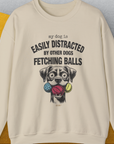 My Dog Is Easily Distracted By - Volume 4: Other Dogs Fetching Balls, Unisex Sweatshirt-Sand, Design by Dog Gang