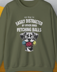 The My Dog Is Easily Distracted By Other Dogs Fetching Balls sweatshirt features a vintage design with a cartoon dog and three balls. Designed by Dog Gang.