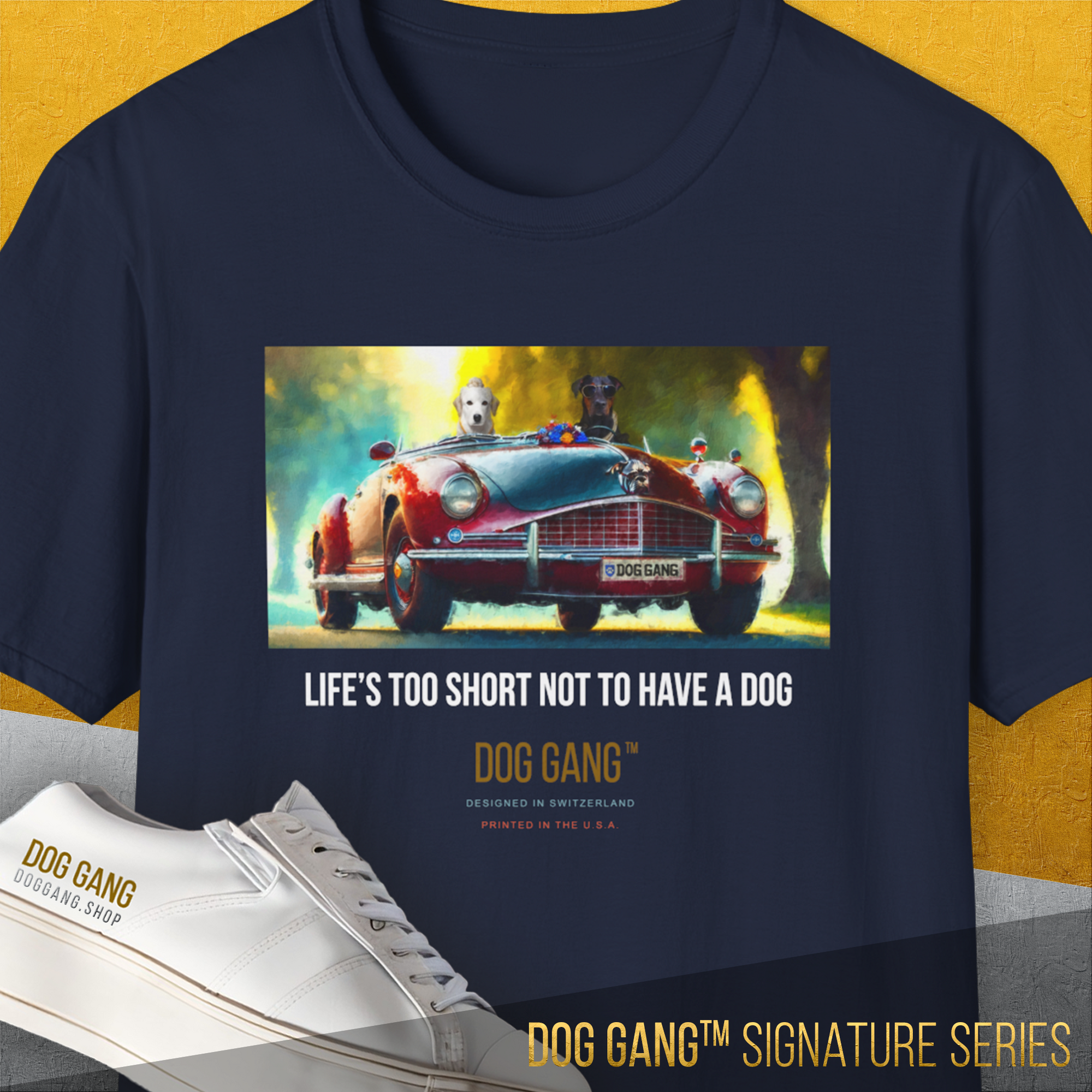 The Dog Gang™ Signature Series, Volume 4 Navy T-Shirt features two dogs in a red vintage car and the phrase Life’s too short not to have a dog. Made from Soft-Style fabric for comfort.