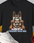 Unisex black cotton T-shirt featuring a cartoon German Shepherd police dog holding a mans picture. Text reads: "BEWARE OF THE UNDERCOVER POLICE DOGS". Funny dog shirt. Designed by Dog Gang.