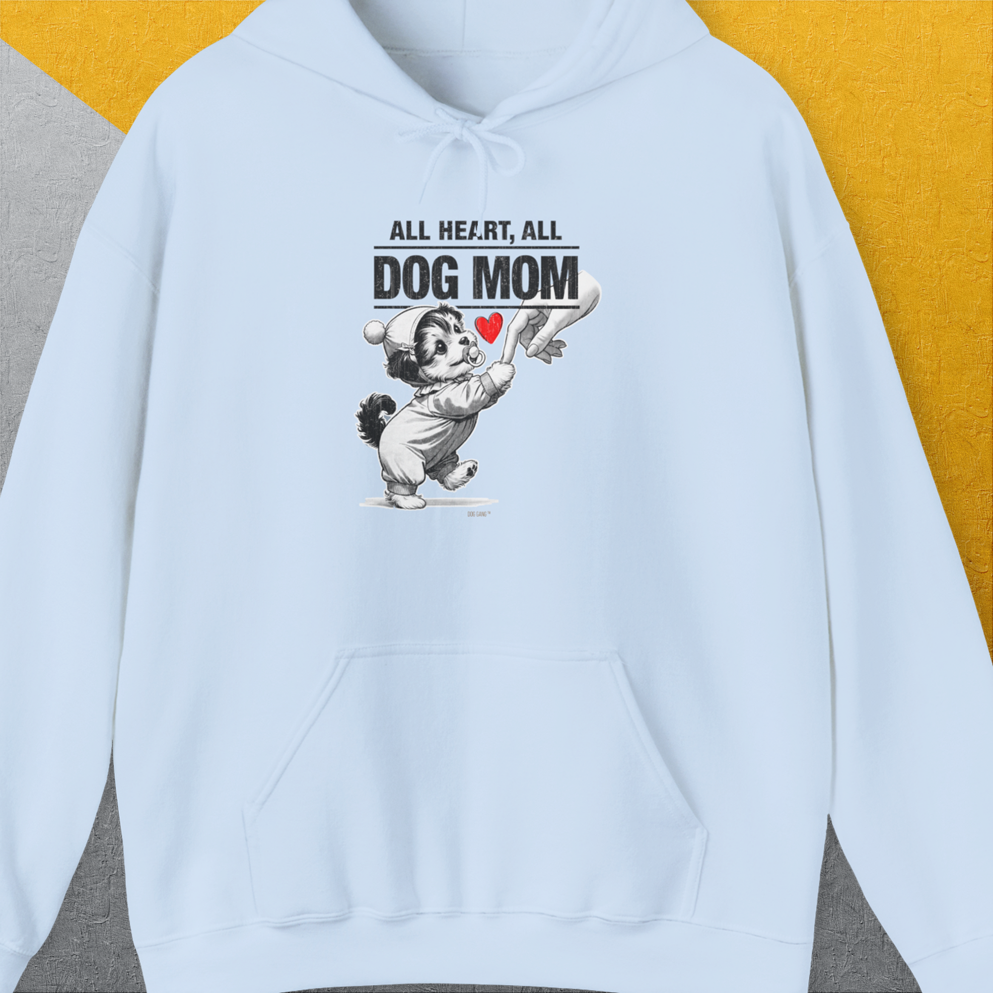 Cartoon dog with a heart saying, All Heart, All Dog Mom. A cute dog design for any dog person. Designed by Dog Gang.
