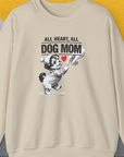 The Dog Mom Series, Volume 9 sweatshirt is a beige crewneck emblazoned with a delightful illustration of a dog dressed in a baby outfit, holding a woman's hand. Prominently displayed above the image is the phrase All Heart, All Dog Mom, accentuated with a vibrant red heart. Shirtdesign by Dog Gang ensures this piece stands out with its commitment to quality and design, using ethically grown cotton and OEKO-TEX-certified dyes for an eco-friendly and stylish choice.