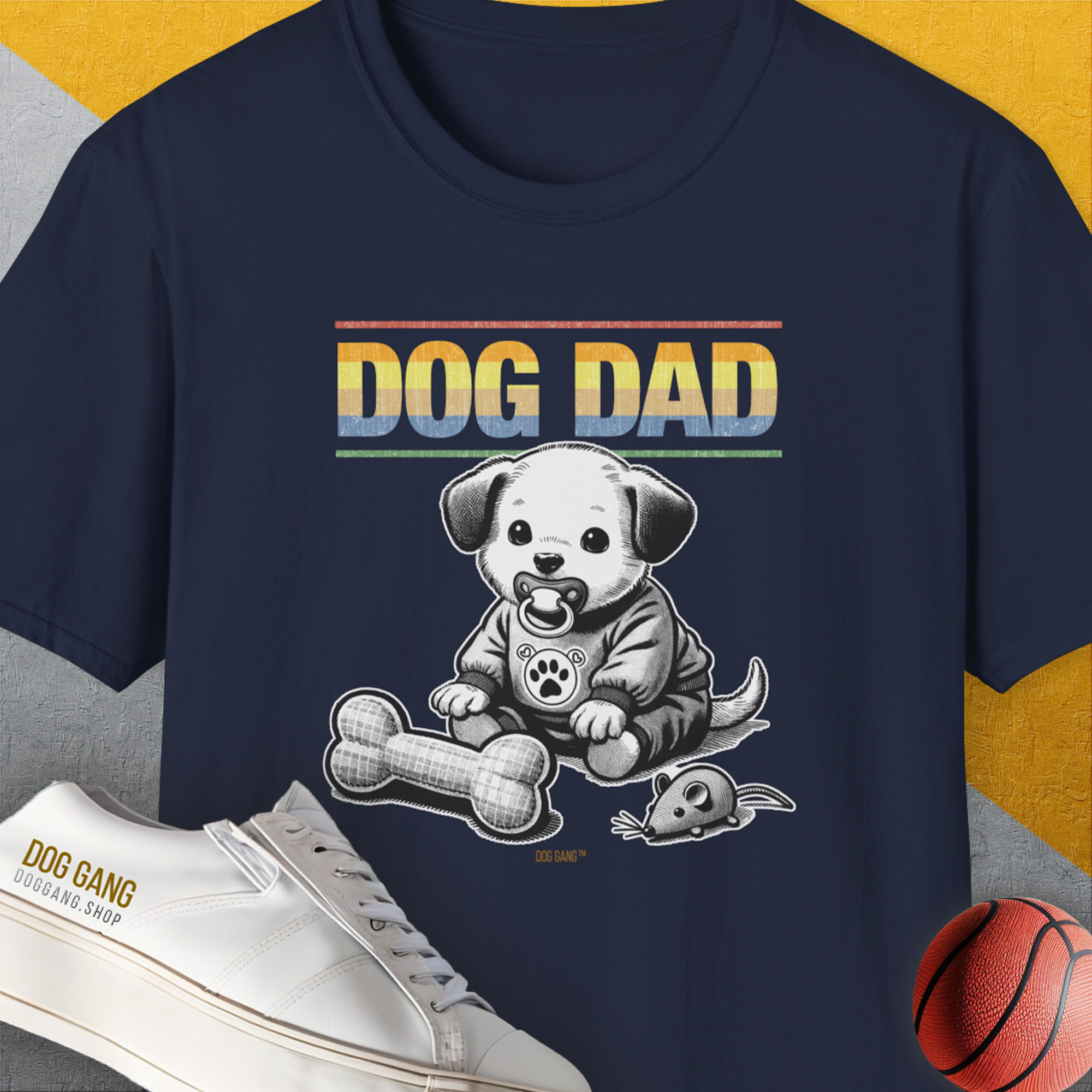 "Dog Dad" - Tee. Cartoon puppy with a fabric bone and a fabric mouse as a toy. Perfect for any dog lover or dog owner. Designed by Dog Gang.