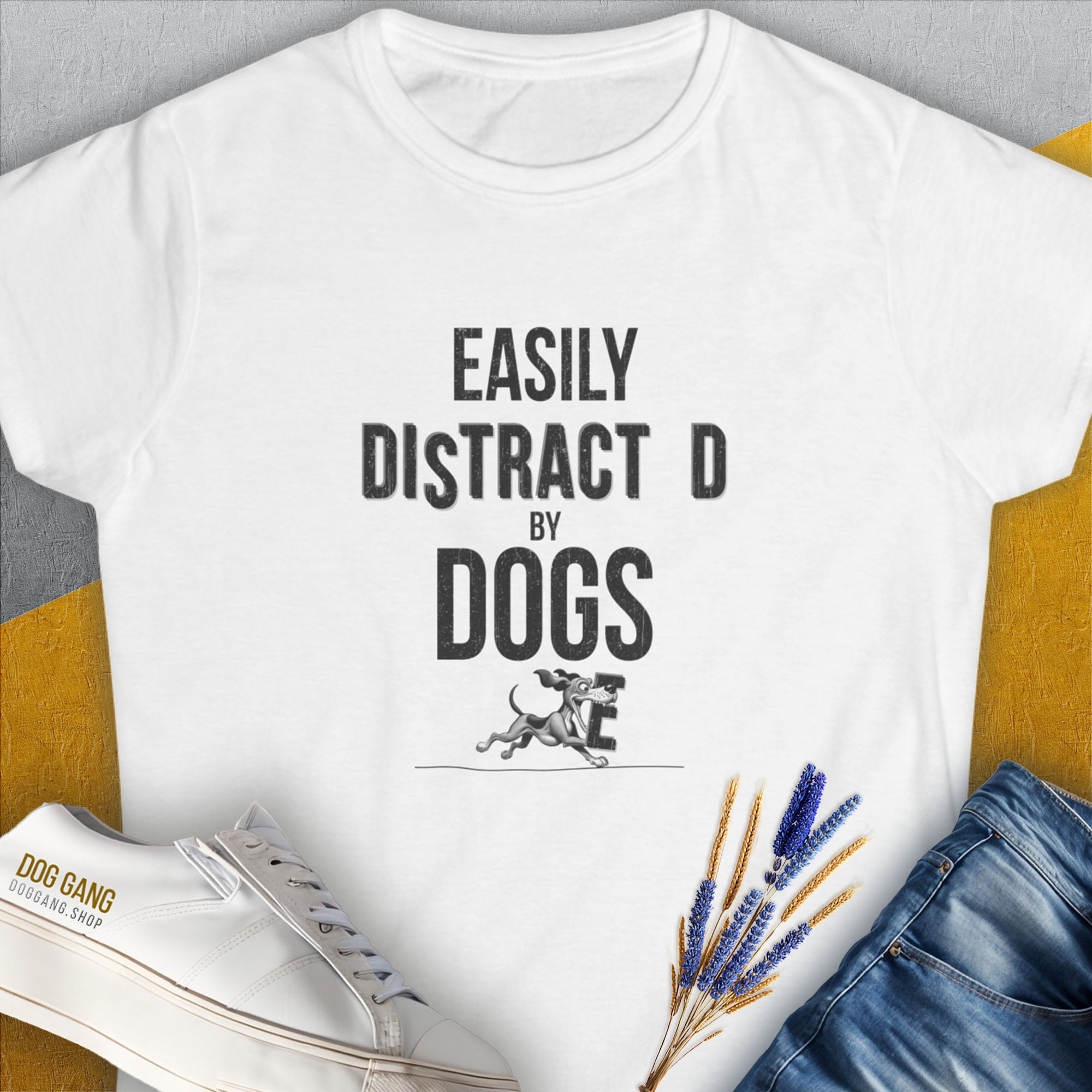 Easily Distracted By Dogs with a cute dog design in playful fonts. Perfect for any dog lover. Designed by Dog Gang.