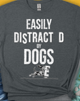 Easily Distracted by Dogs Series, Volume 3 features a cute dog design with the saying Easily Distracted by Dogs in bold. Perfect for any dog lover. Designed by Dog Gang.