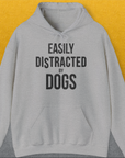 Vintage design with the bold quote EASILY DISTRACTED BY DOGS printed across the chest captures the essence of a dog lover. Designed by Dog Gang.