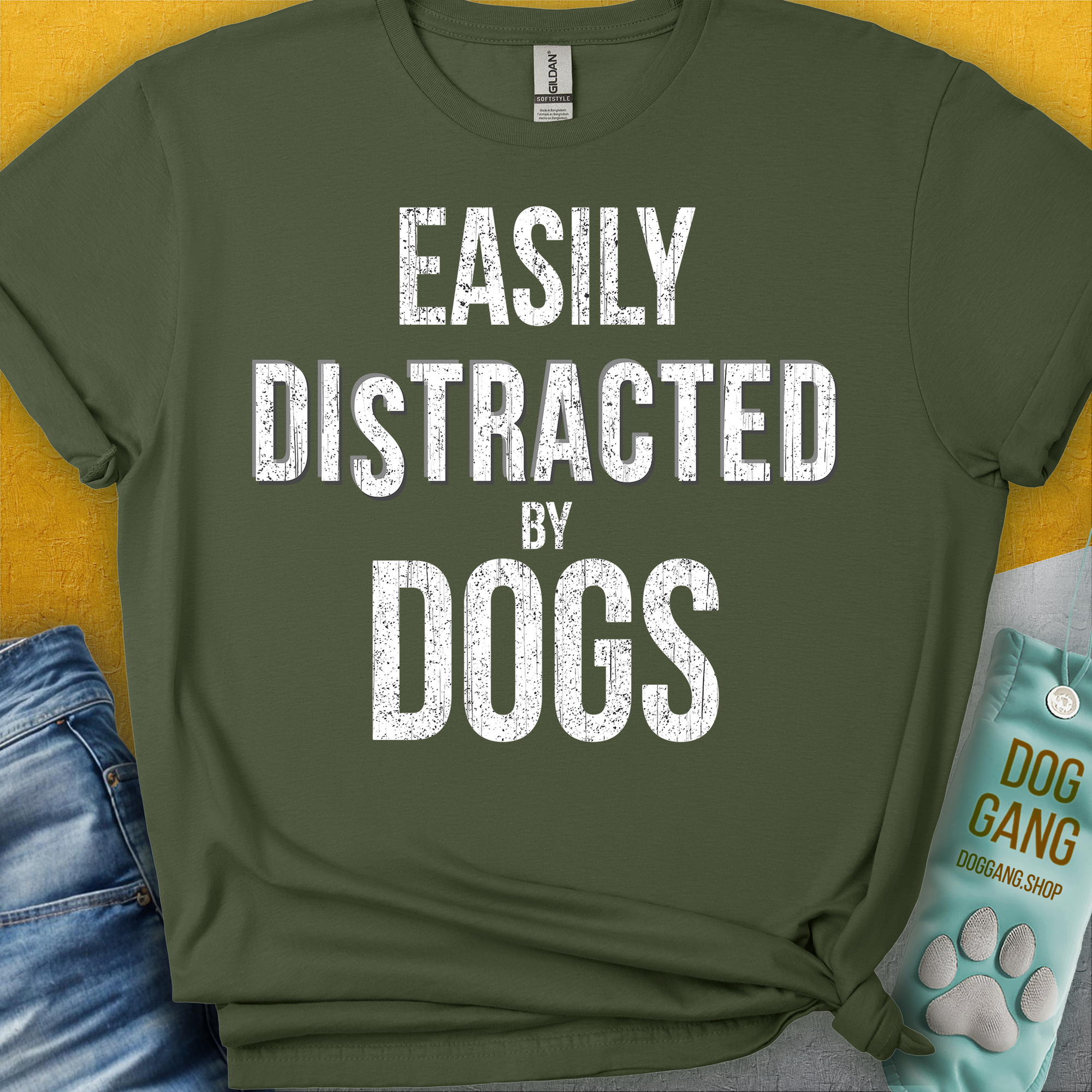 The Easily Distracted By Dogs Series, Volume 4, Unisex T-Shirt in military green features a funny dog-themed quote. This cotton tee is perfect for any dog lover. Designed by Dog Gang.
