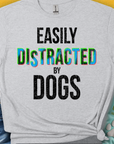 Cute dog design featuring a playful pup with the saying, Easily Distracted by Dogs. Perfect for any dog lover. Designed by Dog Gang.