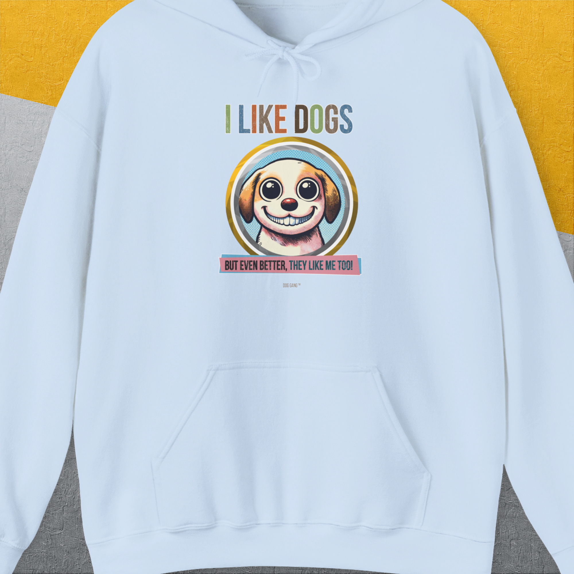 The I Like Dogs And They Like Me Too, Volume 1 unisex hoodie features a cartoon dog face and playful text on light blue. Its a must-have for any dog lover with its cute dog design. Designed by Dog Gang.