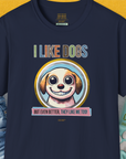 The navy I Like Dogs And They Like Me Too, Volume 1 unisex tee features a smiling dog illustration with the phrases I LIKE DOGS and But even better, they like me too! in yellow. Designed by Dog Gang.