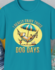 The I Really Enjoy Those Dog Days Unisex T-Shirt in Tropical Blue features a playful puppy design of a dog in a hammock, with the saying: I really enjoy those dog days. Designed by Dog Gang.