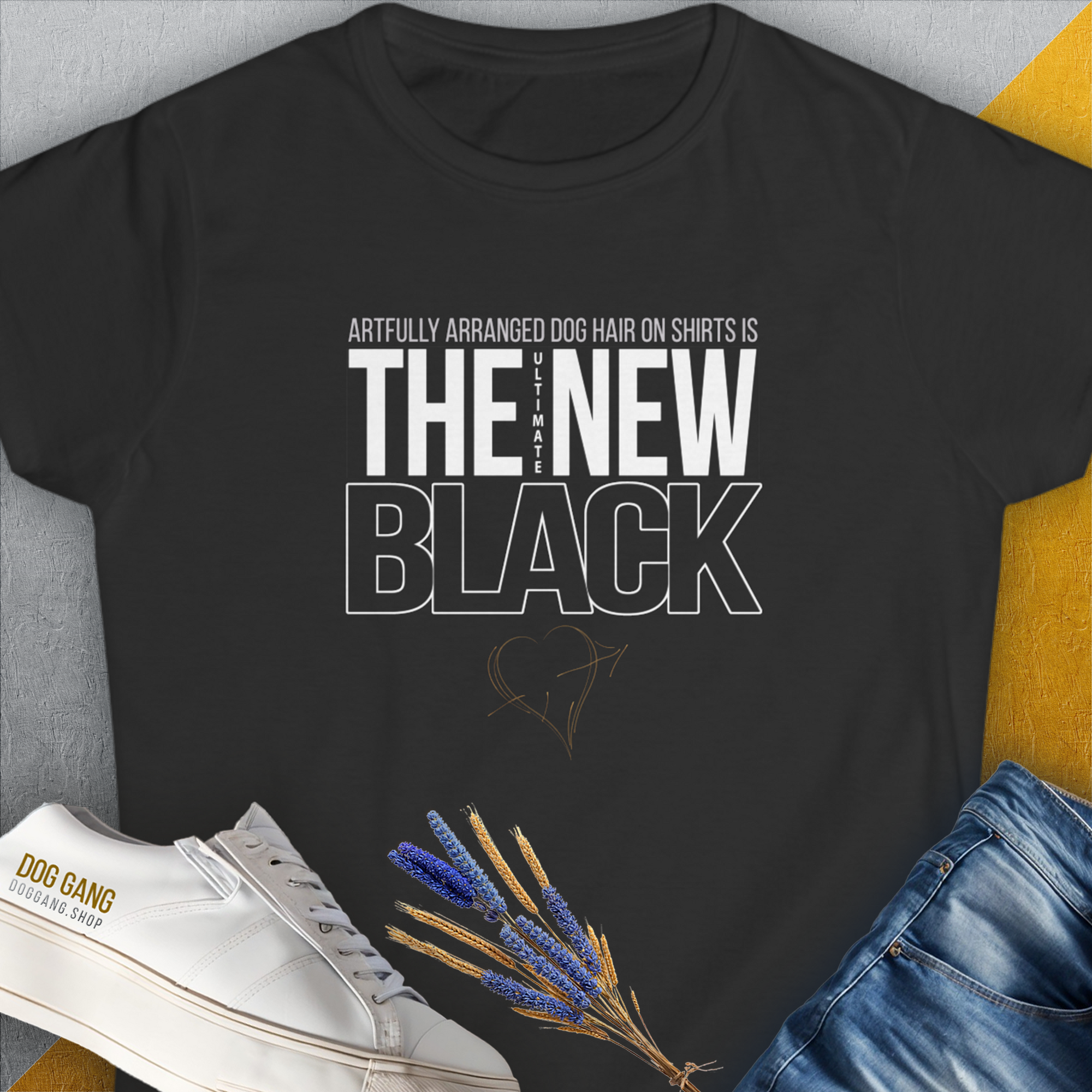 The Ultimate New Black T-Shirt features a funny dog-themed quote in white: Artfully arranged dog hair on shirts is the new black. Designed by Dog Gang.
