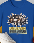 Royal-colored Unleash-Series T-shirt featuring playful puppies breaking through paper with the text UNLEASH MY INNER ADVENTURER, and a small ball. Designed by Dog Gang.