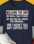 Navy tee features funny text: Avoid Small Talk Until After Coffee in bold, artsy letters. Designed by Dog Gang.
