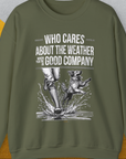 The unisex sweatshirt, Who Cares About The Weather When Youre In Good Company, Volume 1, features a playful slogan and design with a dog jumping beside human legs in boots. Made from an ethically sourced US cotton-polyester blend, it ensures both comfort and responsible sourcing.
