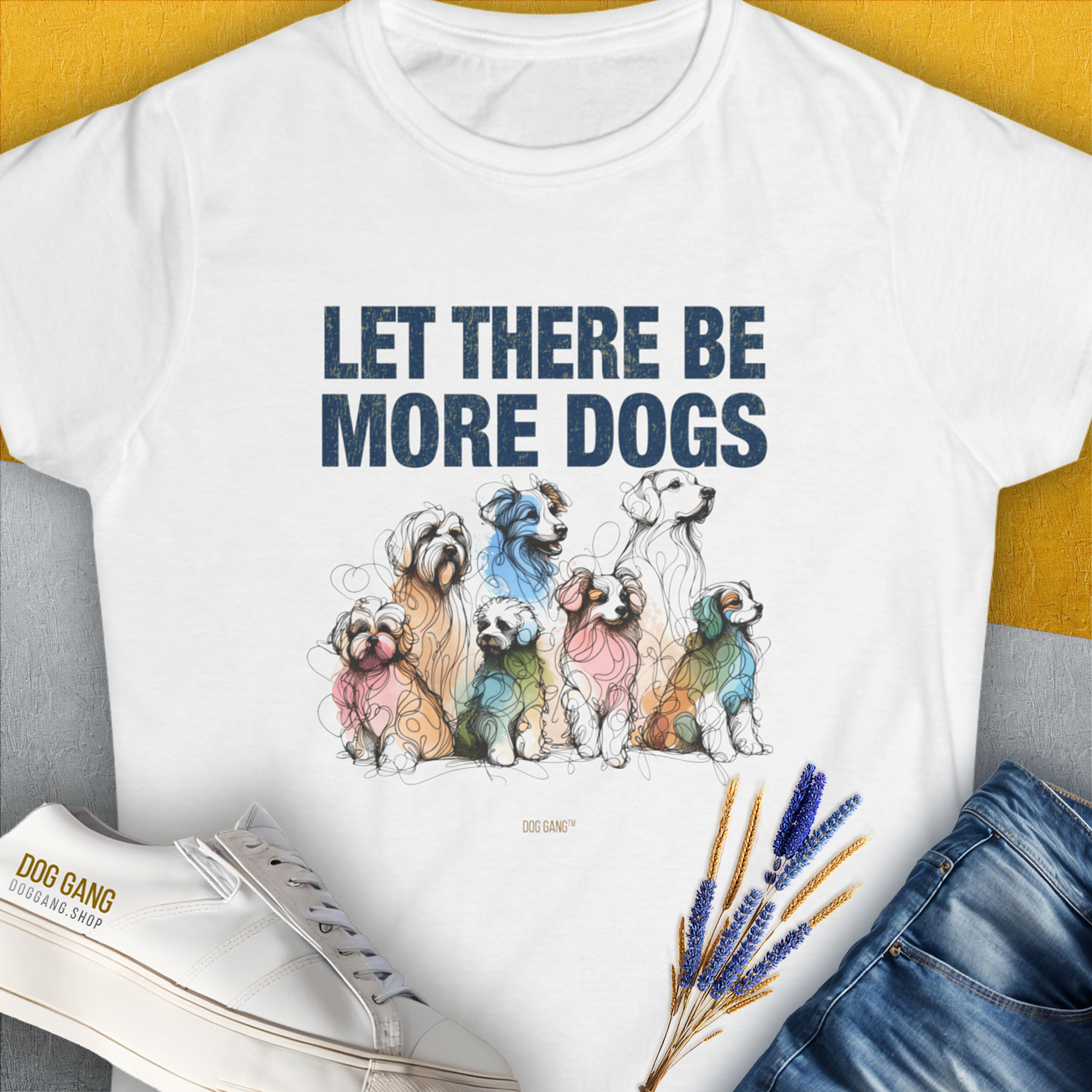 The Let There Be More Dogs womens t-shirt is crafted from soft ringspun cotton, featuring colorful dog illustrations and a dog lover quote. Designed by Dog Gang.