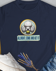 The Allright Come And Get It, Volume 3, Womens T-Shirt in navy showcases a funny poodle graphic with the phrase ALLRIGHT, COME AND GET IT. Designed by Dog Gang.
