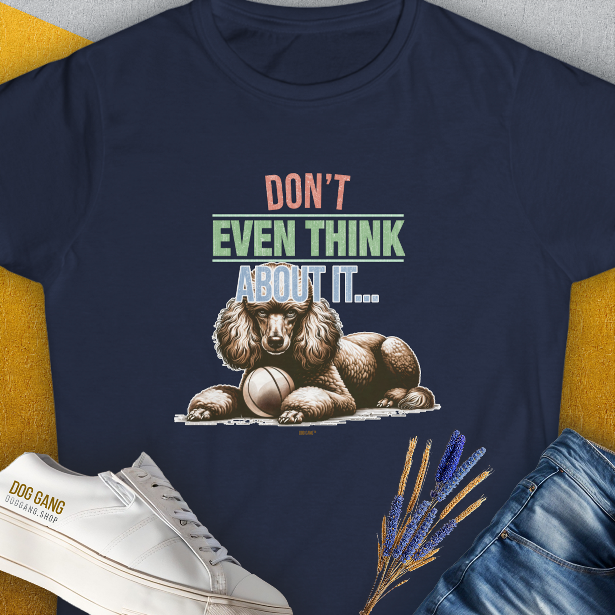 The navy Dont Even Think About It..., Volume 1 T-Shirt is a funny dog shirt featuring a poodle and ball illustration. Perfect for any dog lover. Designed by Dog Gang.