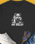 Got Balls? Volume 3 womens t-shirt showcases a bulldog holding two fetch balls in his mouth, paired with the bold text "Got Balls?" A funny dog shirt for every dog lover. Designed by Dog Gang.