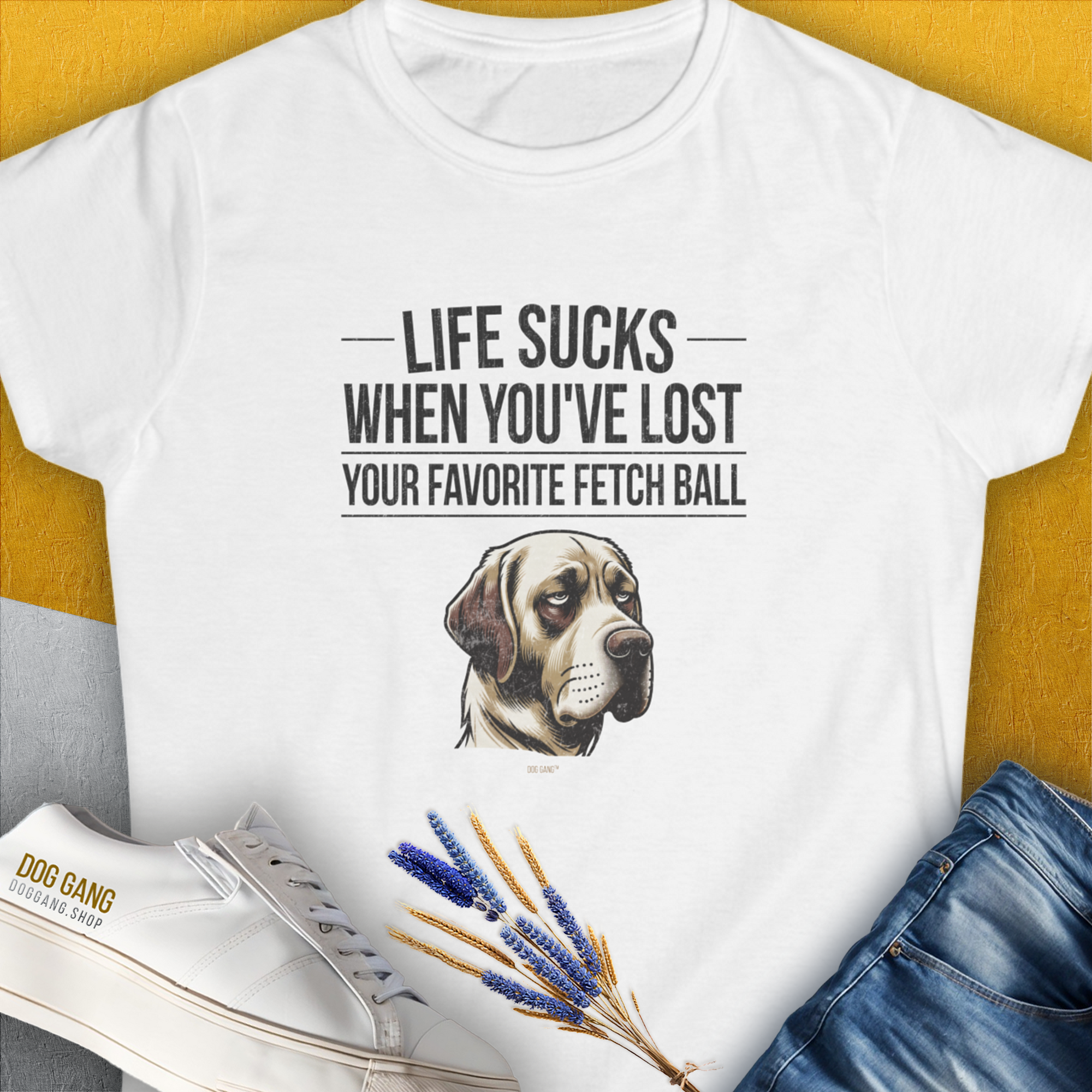 The Life Sucks When Youve Lost Your Favorite Fetch Ball, Volume 1 womens t-shirt showcases a sad dog (Labrador Retriever) illustration with a humorous quote. Designed by Dog Gang.
