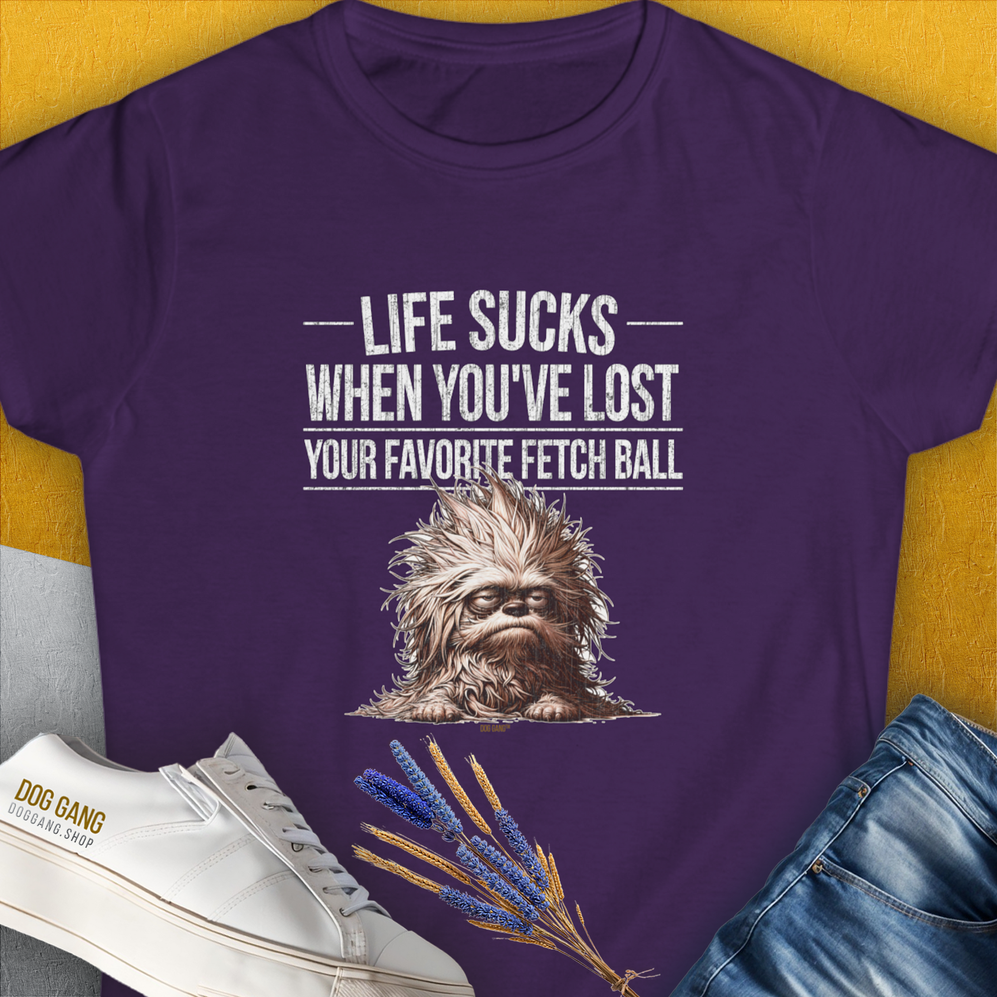 This womens purple tee features a cute dog design with the quote Life sucks when youve lost your favorite fetch ball. A perfect gift for any dog lover. Designed by Dog Gang.
