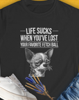Sad dog  (Chihuahua) illustration and the text "Life Sucks When Youve Lost Your Favorite Fetch Ball" create a funny dog shirt perfect for any Chihuahua lover. Designed by Dog Gang.