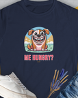 Cute dog design: This funny dog shirt showcases a blue cartoon dog graphic with the playful text Me Hungry? Volume 3 in vibrant colors. Designed by Dog Gang.