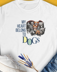 My Heart Belongs to Dogs womens T-shirt features cute dog faces along with the saying My Heart Belongs to Dogs. Perfect for any dog lover. Designed by Dog Gang.
