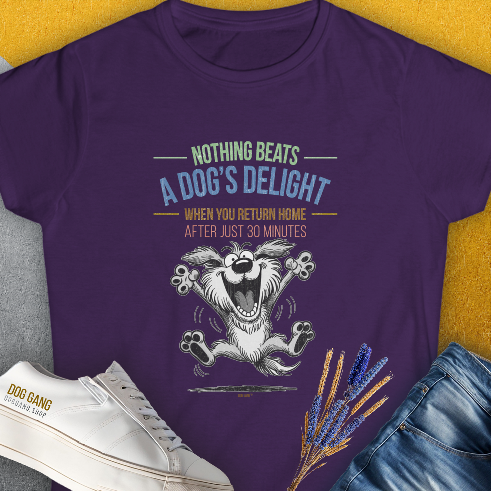 The Nothing Beats A Dogs Delight When You Return Home, Volume 2 womens T-shirt in purple features a joyful cartoon dog with a quote about a dogs happiness. Perfect dog lover gift. Designed by Dog Gang.