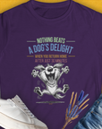 The Nothing Beats A Dogs Delight When You Return Home, Volume 2 womens T-shirt in purple features a joyful cartoon dog with a quote about a dogs happiness. Perfect dog lover gift. Designed by Dog Gang.
