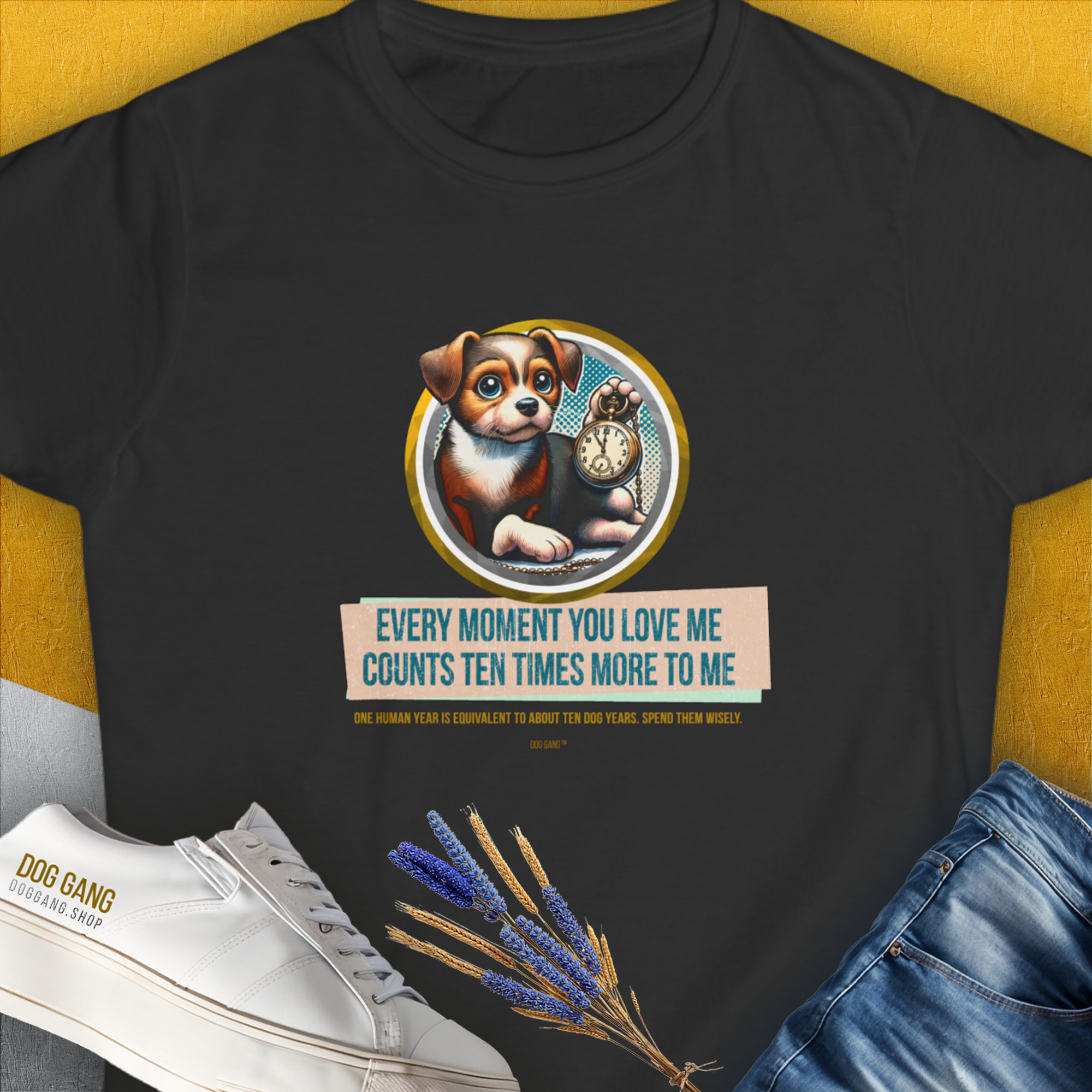 The black Womens T-Shirt features a playful puppy with a clock and the saying: Every moment you love me counts ten times more to me. Designed by Dog Gang.