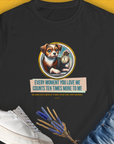 The black Womens T-Shirt features a playful puppy with a clock and the saying: Every moment you love me counts ten times more to me. Designed by Dog Gang.