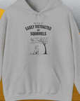 My Dog Is Easily Distracted By - Volume 1: Squirrels, Unisex Hoodie-Sport Grey. A perfect gift for dog lovers and dog owners. Design by Dog Gang