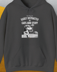 My Dog Is Easily Distracted By - Volume 2: Cats And Stuff, Unisex Hoodie-Dark Heather. A perfect gift for dog lovers and dog owners. Design by Dog Gang
