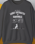 My Dog Is Easily Distracted By - Volume 1: Squirrels, Unisex Sweatshirt-Dark Heather. A perfect gift for dog lovers and dog owners. Design by Dog Gang