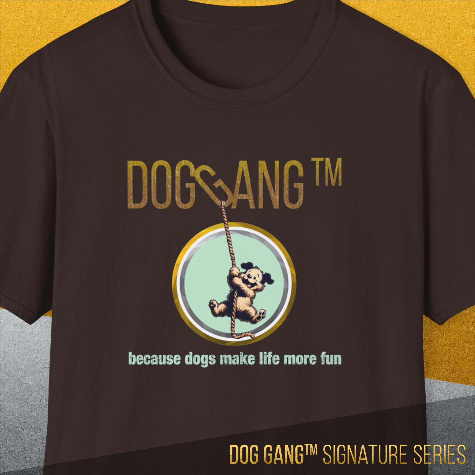 The Dog Gang™ Signature Series, Volume 3 Unisex T-Shirt in Dark Chocolate features DOG GANG™ text above a dog on a rope and because dogs make life more fun below, finished with the Signature Series mark. Made of Soft-Style Baumwolle.