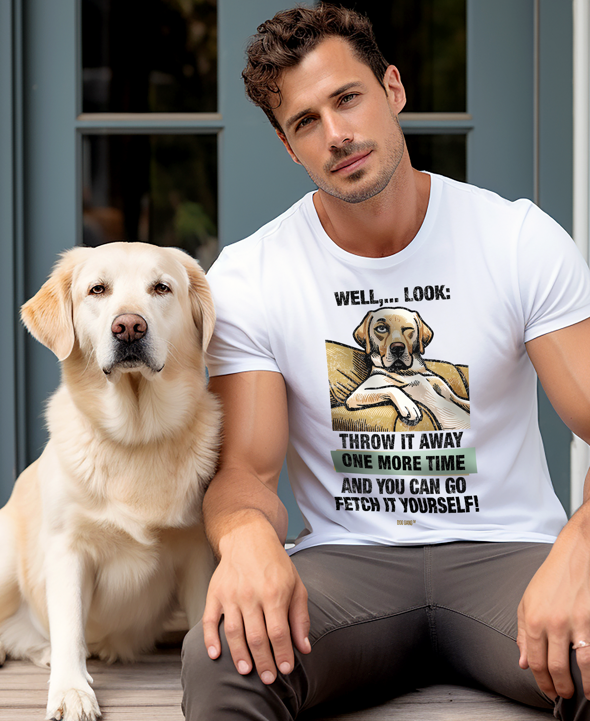 A man sits on a porch next to a yellow Labrador Retriever. He wears a white T-shirt from the Swiss Design-Label DOG GANG, with a cartoon dog and text that reads, Well...look: throw it away one more time and you can go fetch it yourself! The dog sits calmly beside him.