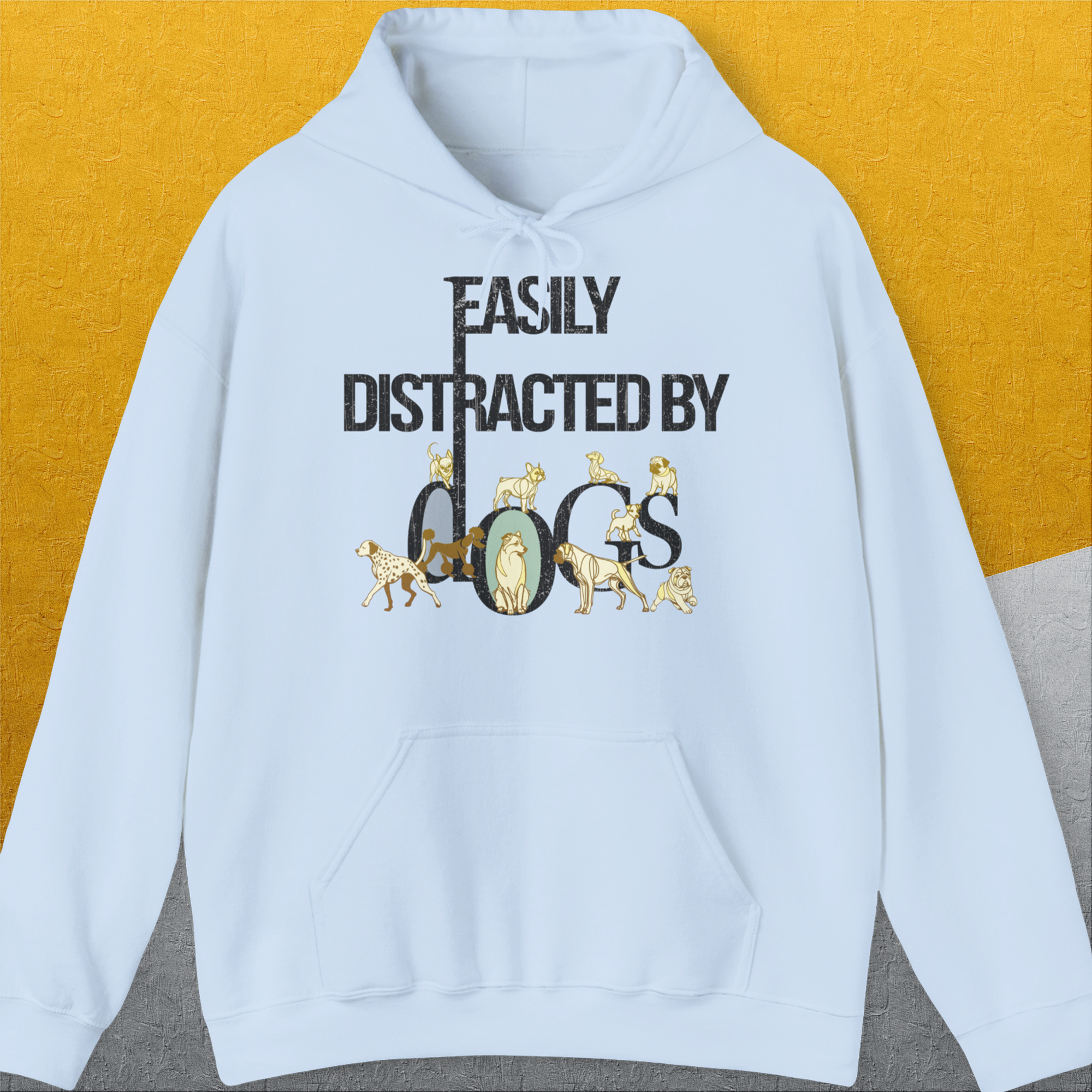 The Easily Distracted By Dogs Series hoodie features charming dog illustrations and text, perfect for any dog-person. Designed by Dog Gang.
