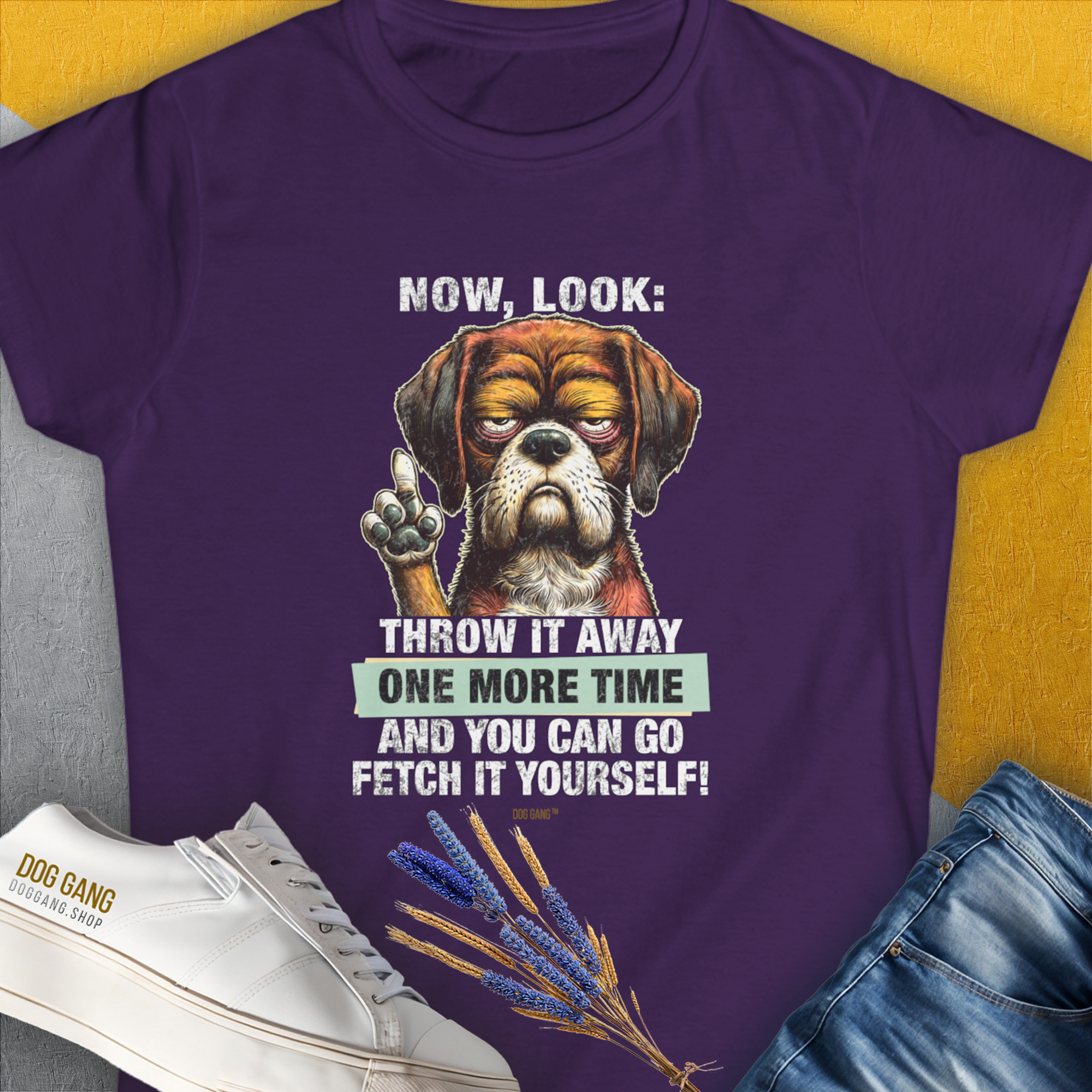 This purple womens t-shirt features a grumpy dog illustration with the quote, Go Fetch It Yourself. A funny dog shirt perfect for any dog lover. Designed by Dog Gang.