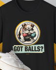 The Got Balls? Volume 1, Unisex T-Shirt in black showcases a funny cartoon bulldog with two fetch balls in his mouth with the phrase "Got Balls?" Its a dog lover gift sure to delight. Designed by Dog Gang.